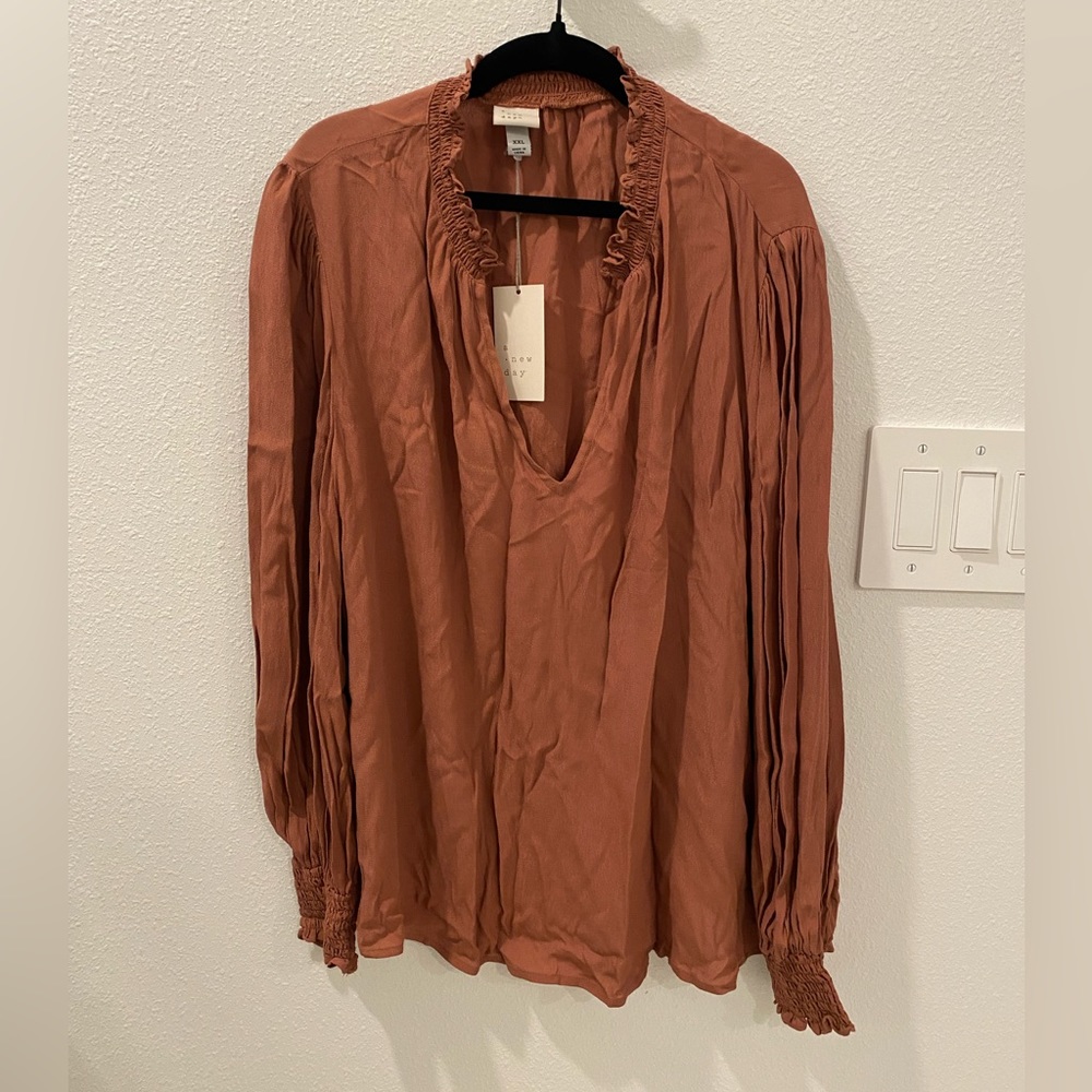 Woman’s long sleeve pop-over top. A new day- blush color